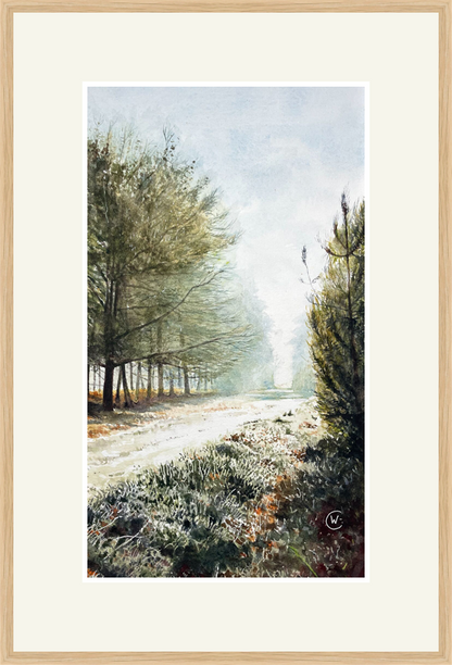 Framed artwork of a forest path with trees and mist